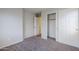 This bedroom features neutral walls, carpet, closet, and ensuite access at 14881 W Ashland Ave, Goodyear, AZ 85395