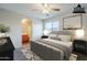 Relaxing bedroom with ensuite bathroom access, neutral decor, and great natural light at 14881 W Ashland Ave, Goodyear, AZ 85395