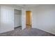 A bedroom with a closet and doorways leading to other rooms at 14881 W Ashland Ave, Goodyear, AZ 85395
