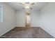 Neutral bedroom featuring carpeted floor, light walls and ceiling fan at 14881 W Ashland Ave, Goodyear, AZ 85395