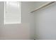 A closet with built-in shelving and a window for natural light at 14881 W Ashland Ave, Goodyear, AZ 85395