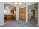 Dining room featuring ample built-in cabinets, an archway view of the kitchen, and neutral color palette at 14881 W Ashland Ave, Goodyear, AZ 85395