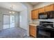 Well-designed kitchen that flows into dining area with sliding glass door, great for entertaining at 14881 W Ashland Ave, Goodyear, AZ 85395