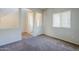 Spacious living room featuring neutral paint, providing a comfortable and inviting space at 14881 W Ashland Ave, Goodyear, AZ 85395