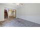 Spacious living room with carpeted floors and staircase leading to the second floor at 14881 W Ashland Ave, Goodyear, AZ 85395