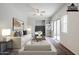 Bright and inviting living room with neutral colors, ceiling fan, and slider door at 14881 W Ashland Ave, Goodyear, AZ 85395