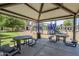 Community playground with metal tables, benches, and ample play equipment at 14881 W Ashland Ave, Goodyear, AZ 85395