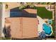 Bird's eye view of backyard showcasing pool, spa, patio, and synthetic grass at 16206 W Cocopah St, Goodyear, AZ 85338