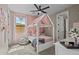 Playful bedroom featuring a custom canopy bed and soft pink walls at 16206 W Cocopah St, Goodyear, AZ 85338