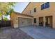 Spacious three-car garage and outdoor patio area perfect for entertaining in Arizona at 16206 W Cocopah St, Goodyear, AZ 85338