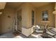 Inviting front porch with decorative wreath, modern seating, and a 