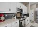 Well-equipped kitchen with modern appliances, stylish backsplash, and ample counter space at 16206 W Cocopah St, Goodyear, AZ 85338