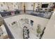 View from the loft showcasing the dining room below, chandelier, high ceilings, and an open and airy layout at 16206 W Cocopah St, Goodyear, AZ 85338