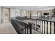 Open loft area featuring decorative railings and an inviting atmosphere for relaxation and entertainment at 16206 W Cocopah St, Goodyear, AZ 85338
