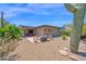 Spacious backyard with fire pit and mountain views, designed for outdoor living and relaxation at 1702 E Staghorn Ln, Carefree, AZ 85377