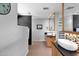 A modern bathroom featuring a sleek vanity, stylish mirror, and contemporary design elements at 1702 E Staghorn Ln, Carefree, AZ 85377