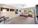 A sunlit bedroom features neutral walls, carpet flooring, ample natural light, and a ceiling fan at 1702 E Staghorn Ln, Carefree, AZ 85377