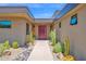 Modern desert home entrance with unique walkway and desert landscaping at 1702 E Staghorn Ln, Carefree, AZ 85377