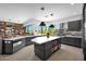 Modern kitchen featuring gray cabinets, stainless steel appliances, and a center island at 1702 E Staghorn Ln, Carefree, AZ 85377