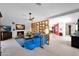 Open living room with modern decor, fireplace, tile floors, and unique design elements at 1702 E Staghorn Ln, Carefree, AZ 85377