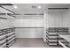 An organized walk-in closet featuring ample shelving, drawers, and storage solutions for optimal organization at 1702 E Staghorn Ln, Carefree, AZ 85377