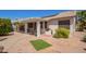 Nicely landscaped backyard featuring a covered patio, built-in grill, and desert landscaping at 17651 N Coconino Dr, Surprise, AZ 85374