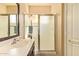 Bathroom featuring a sink and glass-enclosed shower at 17651 N Coconino Dr, Surprise, AZ 85374