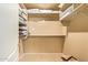Walk-in closet with shelving and hanging rods, providing ample storage space at 17651 N Coconino Dr, Surprise, AZ 85374