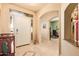Inviting foyer with tile flooring, arched doorways, and a view into the adjacent living spaces at 17651 N Coconino Dr, Surprise, AZ 85374
