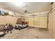 Spacious garage with storage cabinets, an overhead door, and plenty of open space at 17651 N Coconino Dr, Surprise, AZ 85374