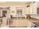Well-lit kitchen featuring stainless steel appliances and granite countertops at 17651 N Coconino Dr, Surprise, AZ 85374