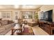 Cozy living room boasting a comfortable seating arrangement, natural light, and a view to the outdoors at 17651 N Coconino Dr, Surprise, AZ 85374