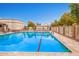 Sparkling community swimming pool with ample lounge seating and well-maintained surroundings at 17651 N Coconino Dr, Surprise, AZ 85374