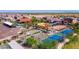 Aerial view showcasing community amenities: pool, tennis courts, shaded picnic areas, and well-maintained landscaping at 17969 W Sand Hills Rd, Surprise, AZ 85387