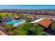 Aerial view highlighting neighborhood amenities, including a swimming pool, shaded areas, and recreational courts at 17969 W Sand Hills Rd, Surprise, AZ 85387