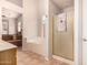Bright bathroom featuring walk in shower, soaking tub and linen closet at 1811 S Brentwood Pl, Chandler, AZ 85286