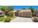 Charming single-story home with a spacious driveway, two-car garage, tile roof, and well-maintained landscaping at 1811 S Brentwood Pl, Chandler, AZ 85286