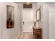 Inviting foyer with tile flooring, decorative niche, and stylish console table at 1811 S Brentwood Pl, Chandler, AZ 85286