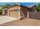 Exterior view of the garage with a neutral color scheme and stone accents at 1811 S Brentwood Pl, Chandler, AZ 85286