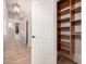 Hallway with access to a shelved closet at 1811 S Brentwood Pl, Chandler, AZ 85286
