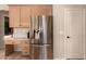 Kitchen features stainless steel refrigerator and convenient built-in desk at 1811 S Brentwood Pl, Chandler, AZ 85286