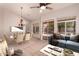 Bright, staged living room and dining area with modern furnishings and sliding door access to the backyard at 1811 S Brentwood Pl, Chandler, AZ 85286