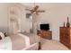 Main bedroom featuring double-height ceiling, ceiling fan, and neutral decor at 1811 S Brentwood Pl, Chandler, AZ 85286