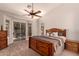 Spacious main bedroom featuring a ceiling fan, access to the backyard pool, and neutral colors at 1811 S Brentwood Pl, Chandler, AZ 85286