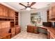 Office with rich wood built-ins, ample storage, and backyard views at 1811 S Brentwood Pl, Chandler, AZ 85286