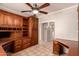 Office features custom wood cabinetry with integrated desks and shelving at 1811 S Brentwood Pl, Chandler, AZ 85286