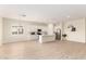 Spacious kitchen with white cabinetry, stainless steel appliances, an island, and light wood flooring at 18453 W Elwood St, Goodyear, AZ 85338
