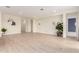 Open-concept living space features light wood flooring and neutral paint at 18453 W Elwood St, Goodyear, AZ 85338
