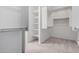 A walk-in closet featuring shelving and racks for efficient storage at 18453 W Elwood St, Goodyear, AZ 85338