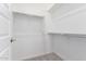 A walk-in closet showcasing metal racks and storage at 18453 W Elwood St, Goodyear, AZ 85338